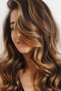 Side Shaved Hairstyle with Caramel Highlights